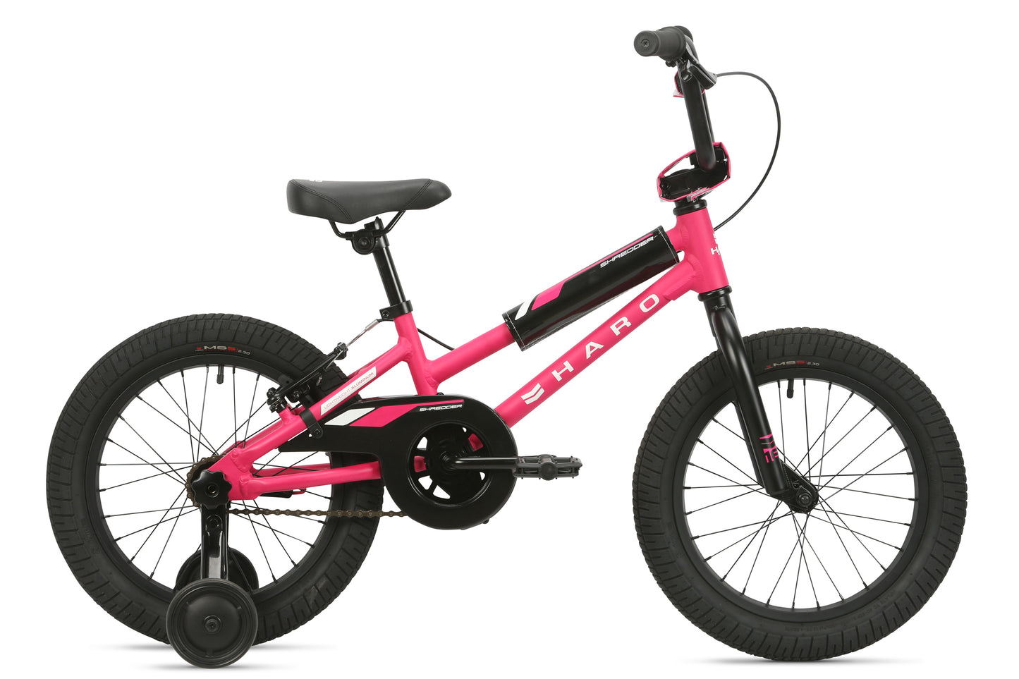 The Shredder 16 Girls by Haro Bikes is a pink bike with black handlebars, seat, and tires. It features training wheels, a chain guard for safety, and a lower top tube for easy mounting. The brand name is prominently displayed on the frame, ensuring a quality ride with style.