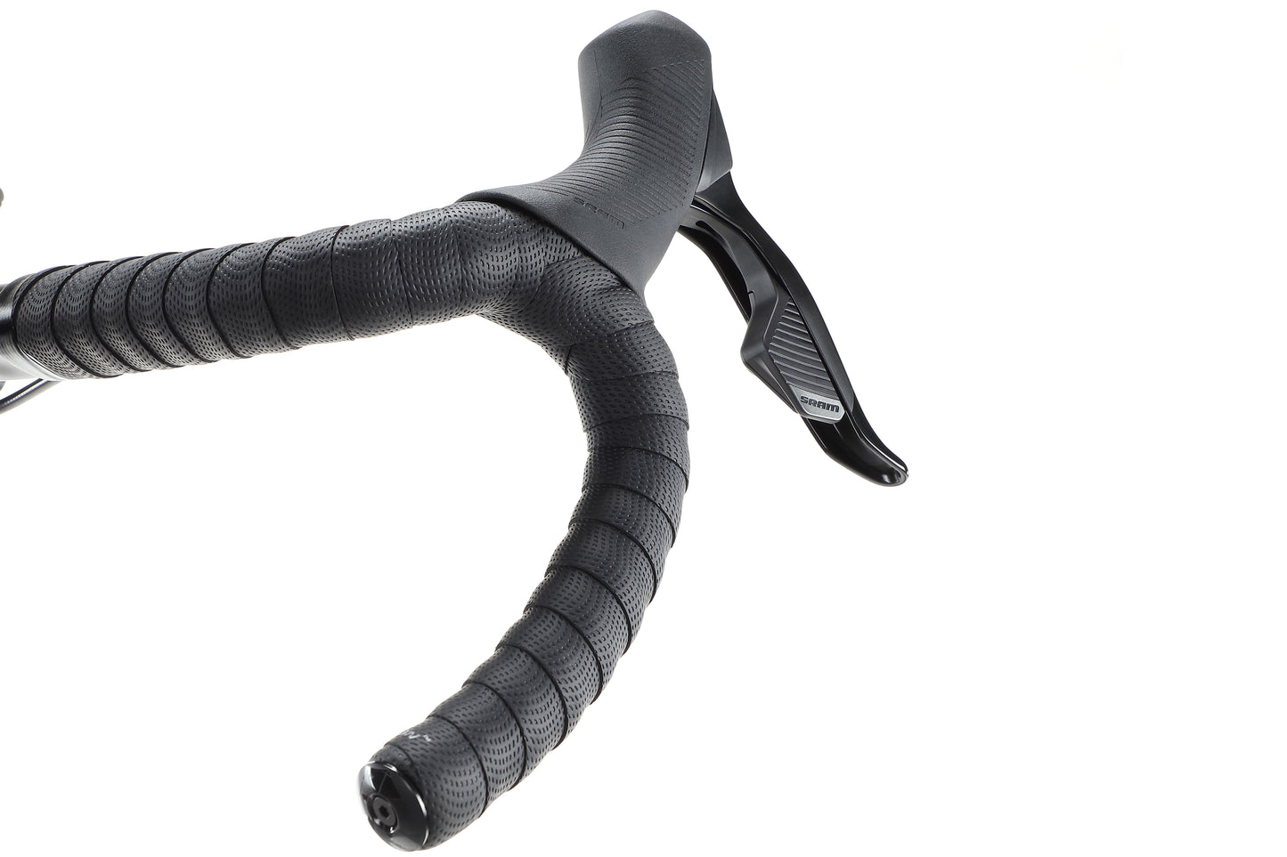 Close-up of Buzzard Carbon 1s black gravel bike handlebars with textured grip and brake lever on a white background.