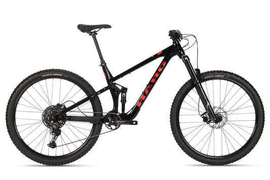 The Daley Alloy 3 is a black all-mountain 29er with thick tires, front suspension, and a red Haro logo on its aluminum frame.