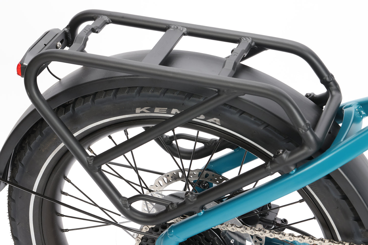 Close-up of the Skwad LT’s rear wheel with a black metal cargo rack, ideal for carrying gear on your e-bike rides.