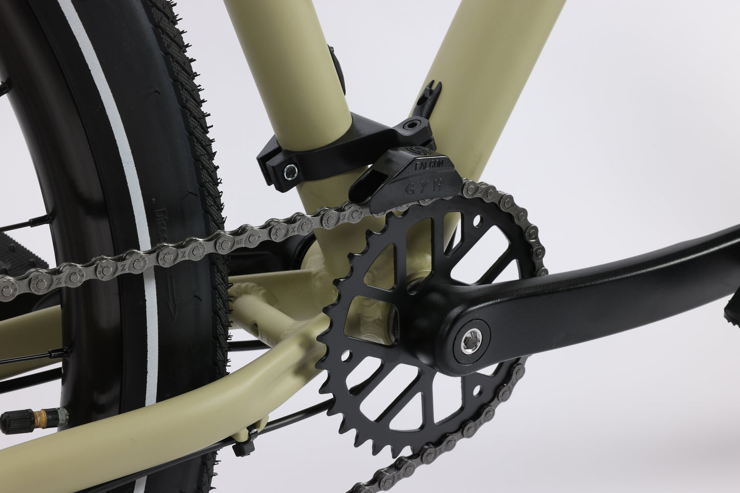 Close-up of the Beasley Two 29 chain and black gear crank with a beige frame and Shimano Acera drivetrain on a white background.