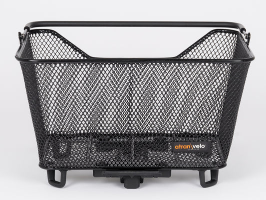 This sturdy, rectangular black mesh bike basket named Daily Basket Small by Atran Velo features a steel frame, a brand label on the front, and an AVS system mounting mechanism at its base for secure attachment to a bike rack.