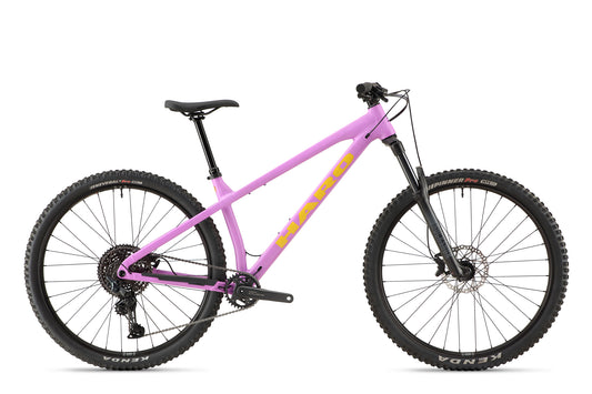 A pink Saguaro 3 hardtail mountain bike with black tires, front suspension, and yellow logo, side view on white background.