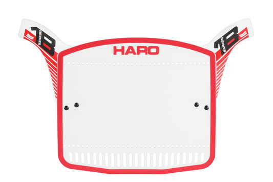 The white and red Series 1B Number Plates by Haro Bikes feature 80s-style design with Haro at the top and winged black and red graphics, complete with small holes for mounting adjustments.
