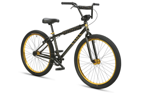 The Haro Bikes B.M.F 26 is a sleek black BMX bike with gold accents, sturdy frame, large wheels with gold rims, and a comfortable black seat. Its minimalist design and high handlebars capture the essence of Bike Life, making it perfect for any aspiring Chad Kerley.