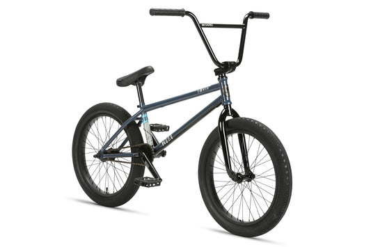 The Haro Bikes Hoover, a blue BMX bike with black handlebars, a black seat, and chunky tires, is displayed against a white background. It boasts a sleek chromoly frame designed for freestyle riding and includes a freecoaster hub for smooth backward pedaling.