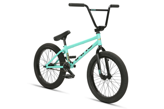 The La Bastille Freecoaster is a teal BMX with black handlebars, seat, pedals, and tires—great for freestyle—on a white background.