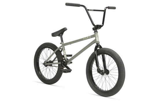 The SD AM by Haro Bikes features a matte gray chromoly frame with black handlebars, seat, pedals, and tires. Viewed from a slightly angled side perspective, it boasts a simple yet sturdy design inspired by Dennis Enarson.