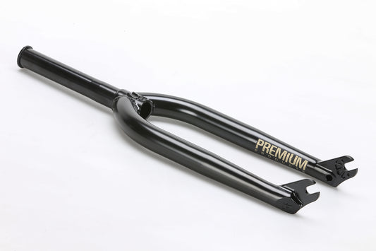 The CK V2 Fork by Premium is a black BMX fork with Premium in gold, crafted from durable chromoly tubing with tapered legs. Positioned horizontally on a plain white background, it highlights its sleek design and matte finish.