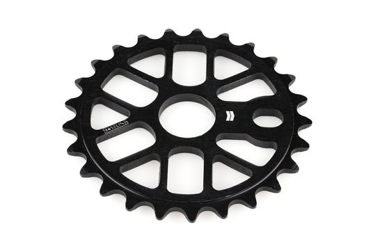 The Baseline Sprocket by Haro Bikes, crafted from black aluminum with a central circular hole and evenly spaced teeth, showcases an innovative bike design. Set against a plain white background, this lightweight component is engineered for optimal weight savings.