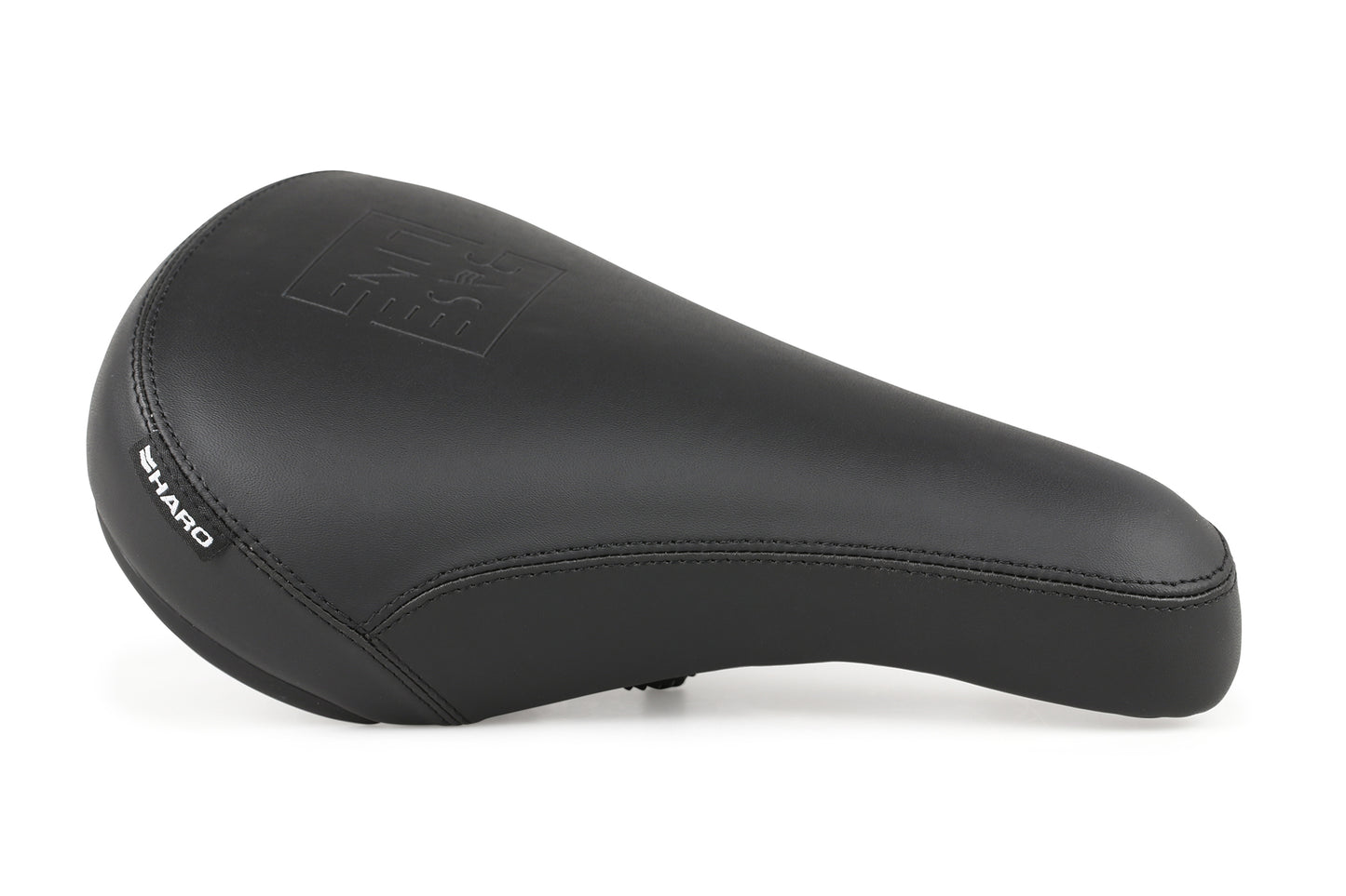 A Baseline Stealth Seat with a sleek design, the black bicycle seat is made from smooth PU leather, features a stitched Baseline logo on top, and is labeled Haro on the side.