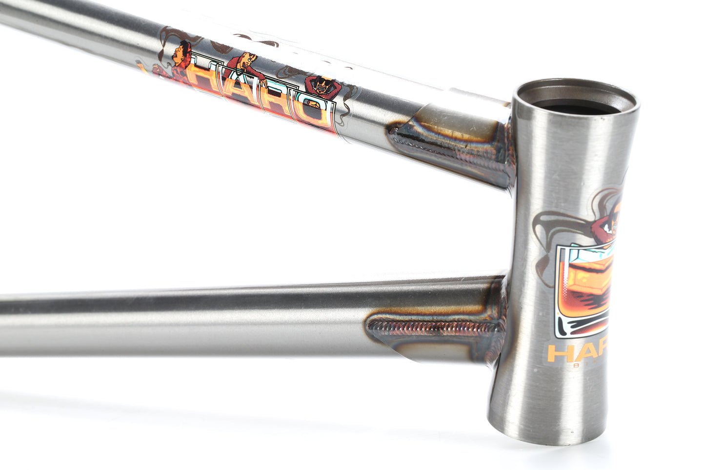 Close-up of a Haro Bikes CK V3 Frame highlighting its detailed welding and vibrant graphics, including the brand name. The angled frame showcases a smooth surface and intricate design, promising enhanced strength ideal for street riding adventures.