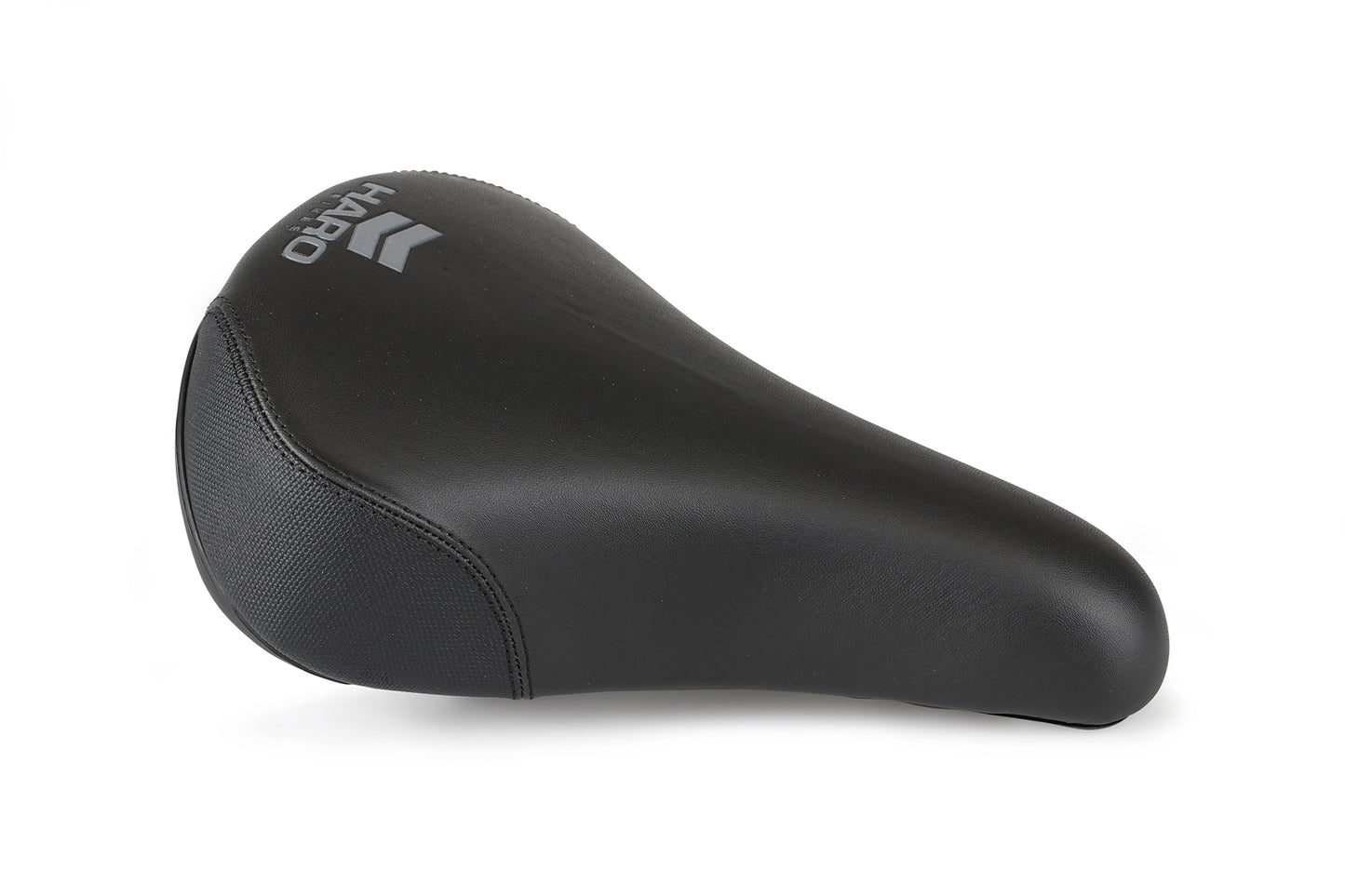 A black Chevron Railed Seat by Haro Bikes features a chevron-railed design for added style, offering a smooth, cushioned surface with wide padded foam and tapered edges for comfort and durability, set against a plain white background.