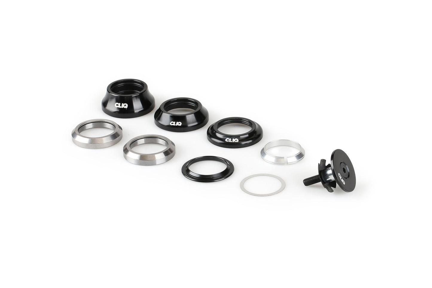 The Haro Bikes Cliq Integrated Headset, featuring black and silver components with sealed bearings, is neatly arranged on a white background. This precision-fit set includes cups and spacers designed for bike frame installation.