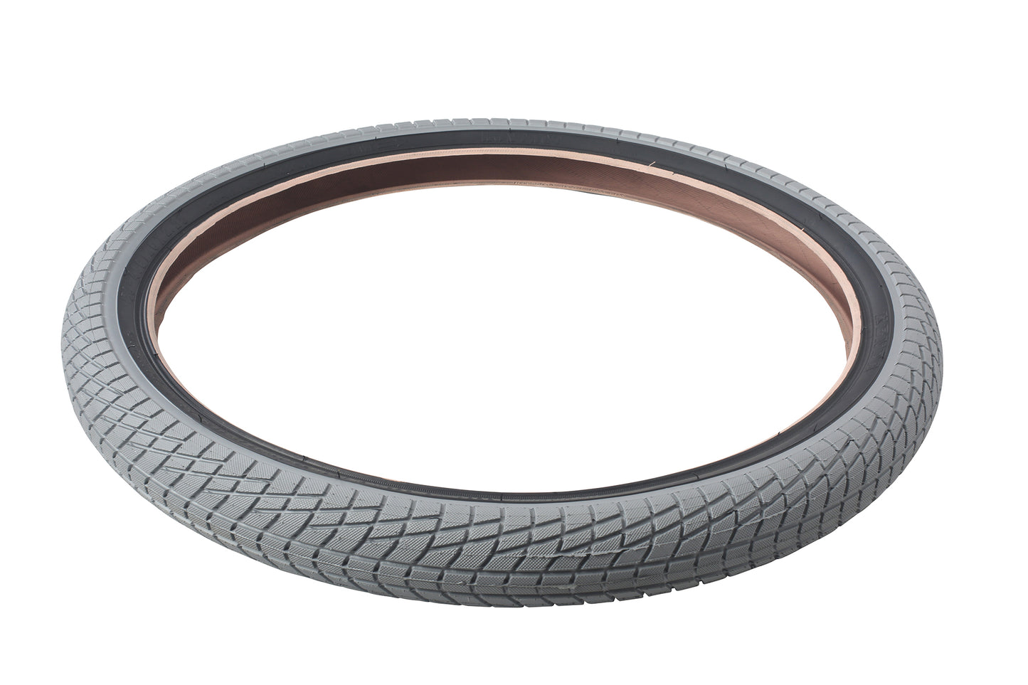 The Haro Bikes Downtown Tire Grey/Black features a textured tread for excellent traction and highlights its stylish reddish-brown inner rim on a white background. Ideal for urban cycling, this entry-level tire is available in multiple sizes to meet diverse needs.