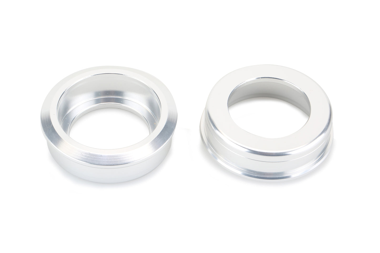 Two sleek, silver metallic rings called Fusion BB Cups by Haro Bikes are aligned on a plain white background, featuring smooth surfaces and central hollows similar to USA BB shells.