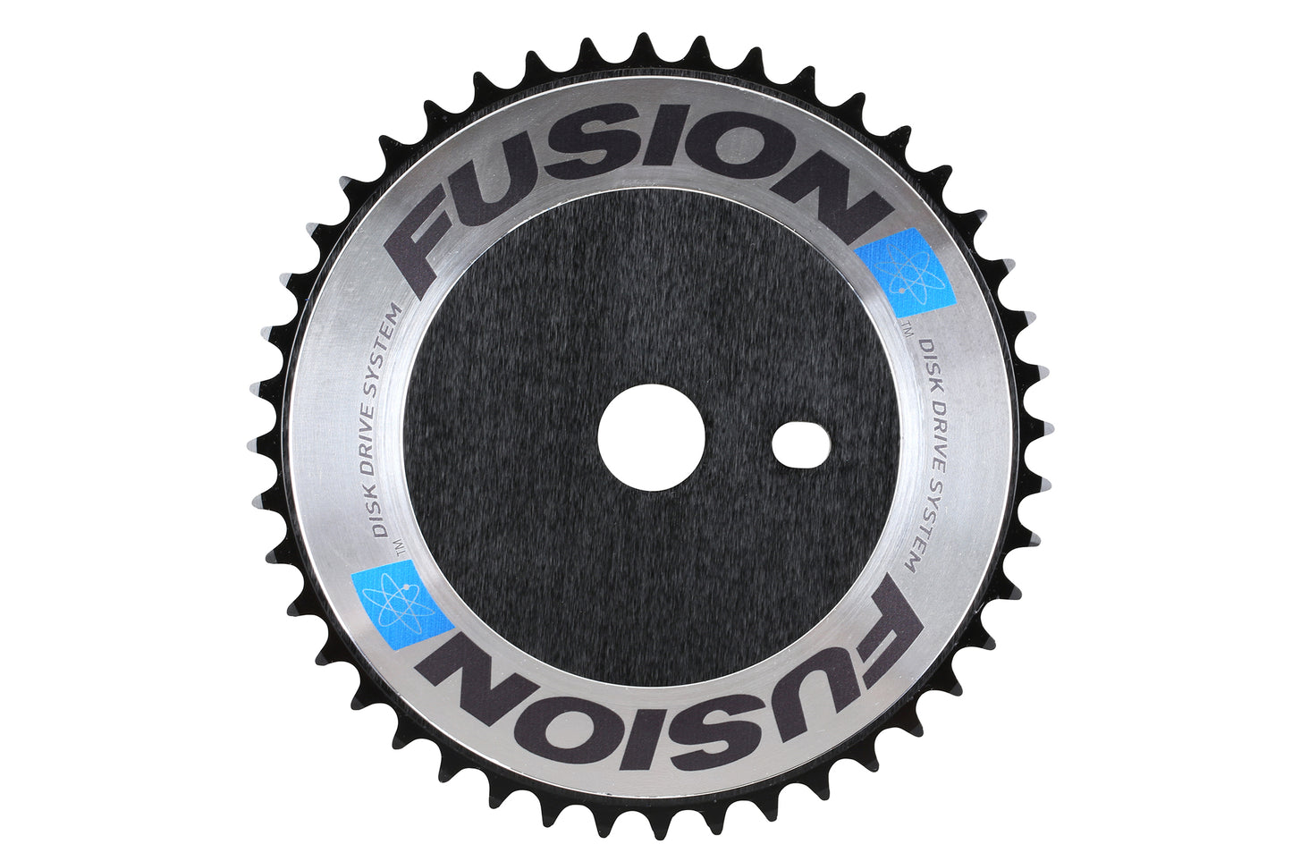 A circular bicycle chainring by Haro Bikes, named Fusion Disc, features a black center, silver edging, and Disk Drive System text with atom-like symbols. It has multiple teeth around the edge.