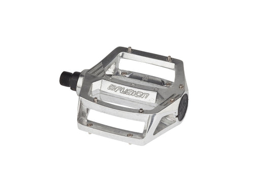 The Haro Bikes Fusion Pedals are silver, rectangular, and crafted from durable 7075 aluminum. They feature FUSION engraved on the side and have a sleek black spindle attachment with multiple openings.