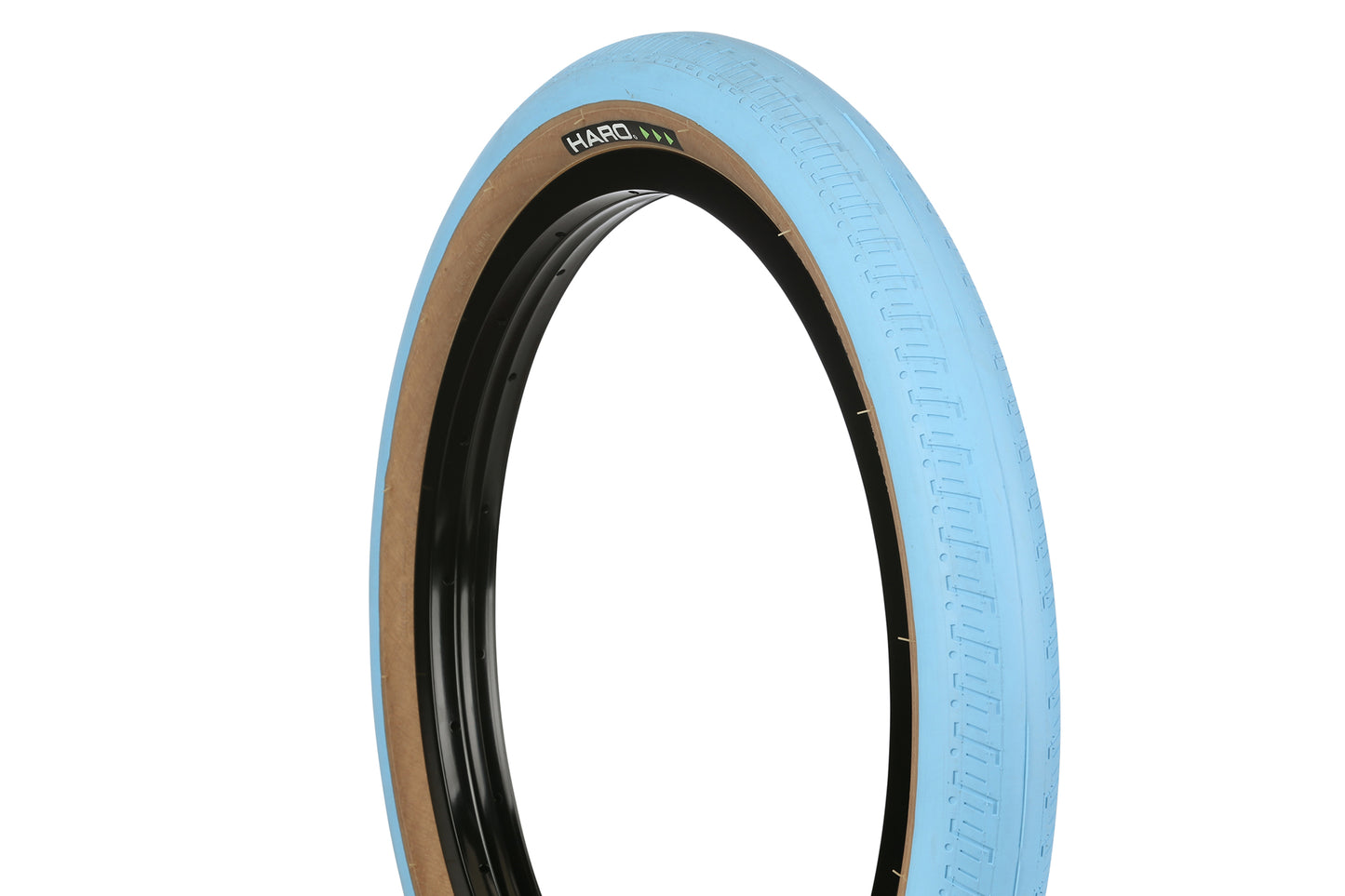 The HPF tire by Haro Bikes is designed for ramps or street, featuring a black inner, blue outer, brown sidewall, and HARO branding in black with green accents. Displayed against a plain white background.