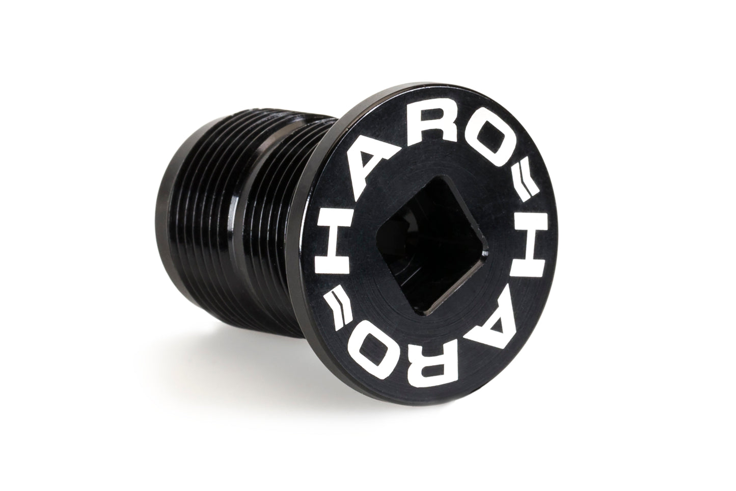 Close-up of a black SD V3 Fork cap by Haro Bikes, featuring Haro in white. The cap is ideal for chromoly construction enthusiasts and has a square center opening with a grooved exterior for threading.