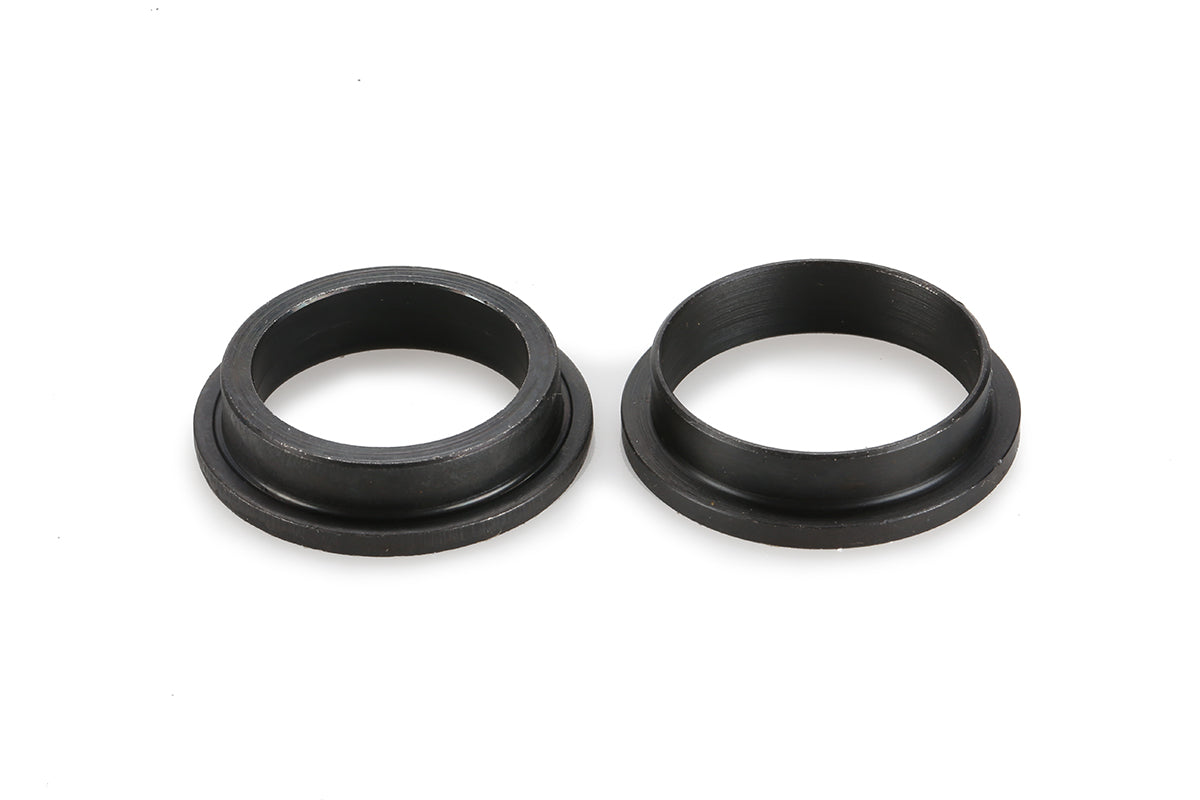 Two Sprocket Adapter 19-22mm by Haro Bikes are placed side by side on a white background, featuring a flanged base and cylindrical body in black rubber.
