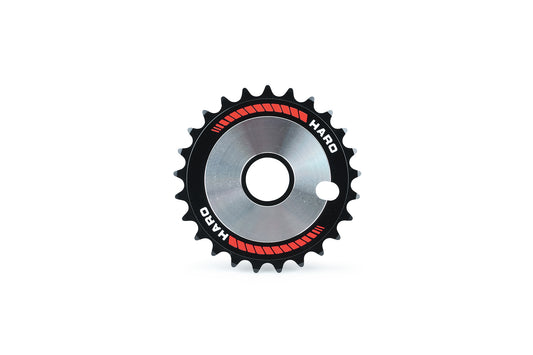 A Haro Bikes Haro Team Disc metal sprocket gear, featuring a black outer edge with red accents and a central circular hole, is displayed against a white background, embodying genuine vintage style.