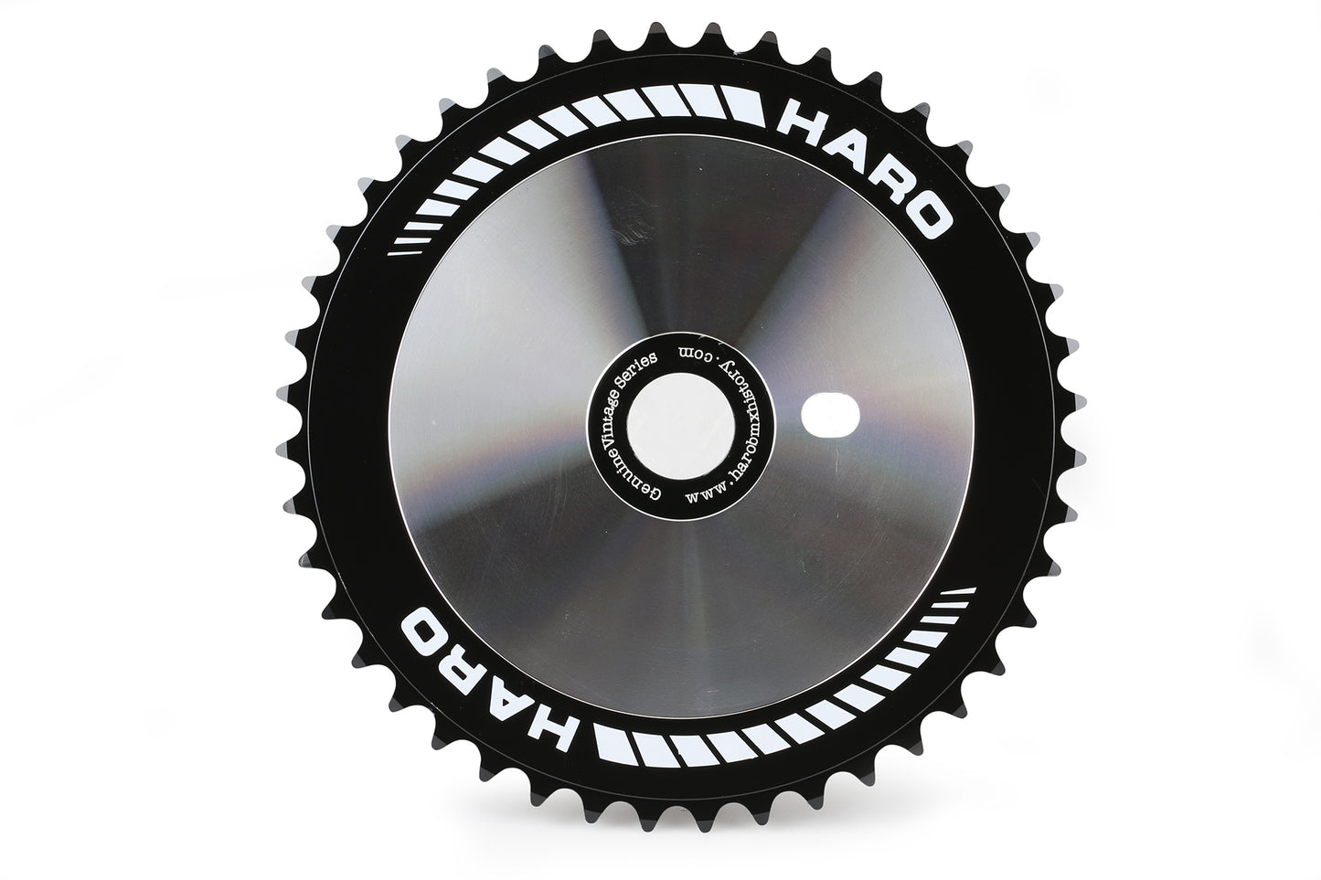 The vintage Haro Team Disc by Haro Bikes is a sleek black chainring featuring silver accents and Haro branding. It has a glossy finish, 44T count, circular shape, and mounting holes for easy installation on BMX bikes.