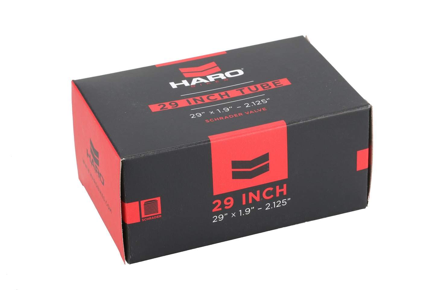 A sleek black and red box labeled HARO 29-Inch Bike Tube by Haro Bikes shows its specs: 29 x 1.9-2.125 and Schrader Valve. The mostly black design with bold red highlights features the logo at the top.