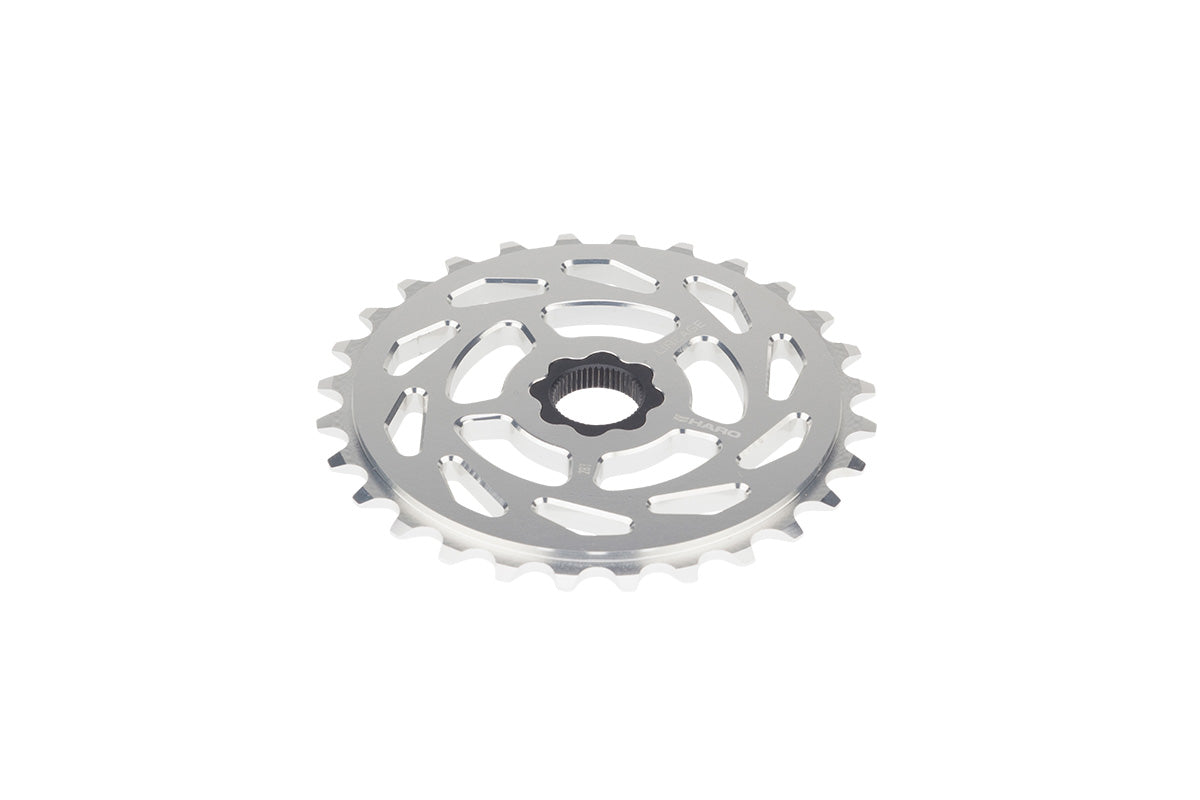 The Lineage Spline Drive Sprockets by Haro Bikes feature a CNC-machined aluminum cog with a 48-spline insert, intricate edge cutouts, and numerous teeth, all gleaming to highlight its polished texture against a pristine white backdrop.