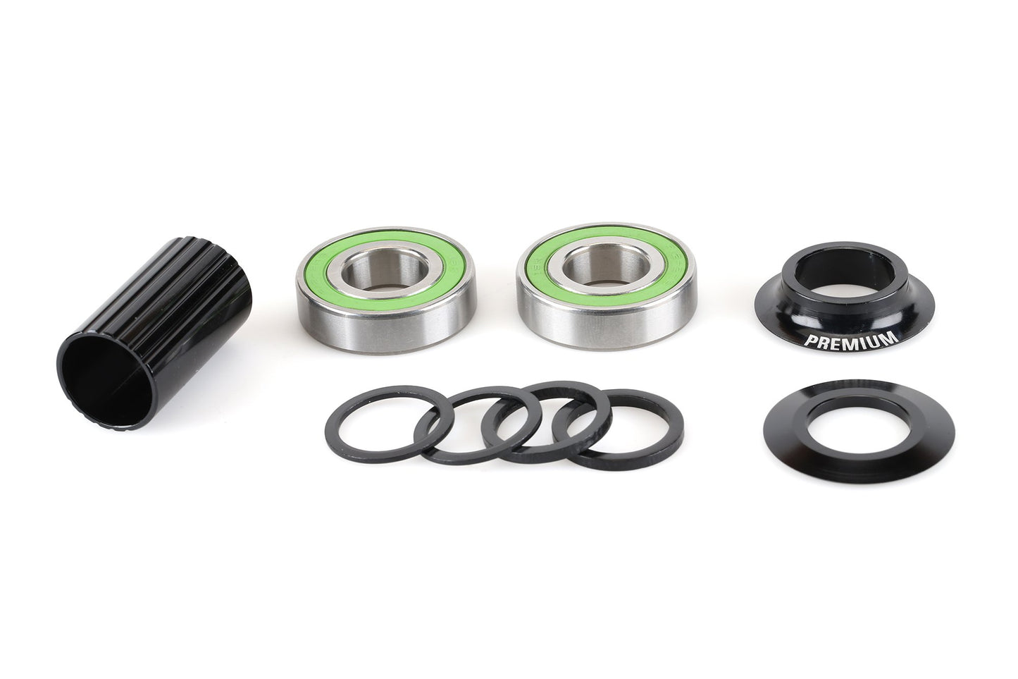 The Premium 19mm Bottom Bracket by Premium includes heavy-duty steel bearings, bearing cups, green seals, a black threaded sleeve, washers, and black bearing covers. All components are part of a sealed system and displayed on a white background.
