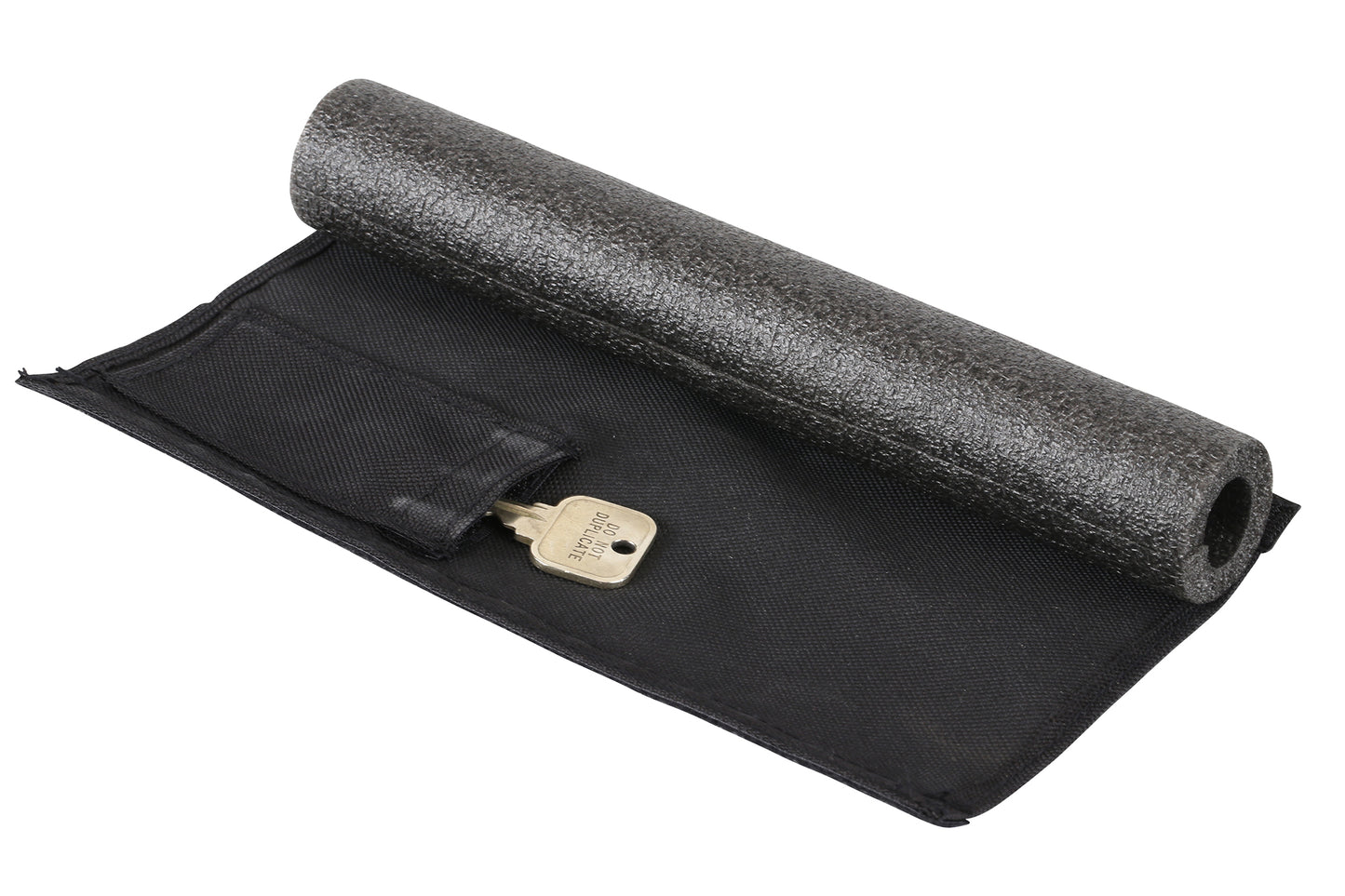 A Premium Cross Bar Pad, branded by Premium, is placed on a black fabric pouch with a transparent pocket revealing a brass key. The roller and pouch are isolated against a white background.