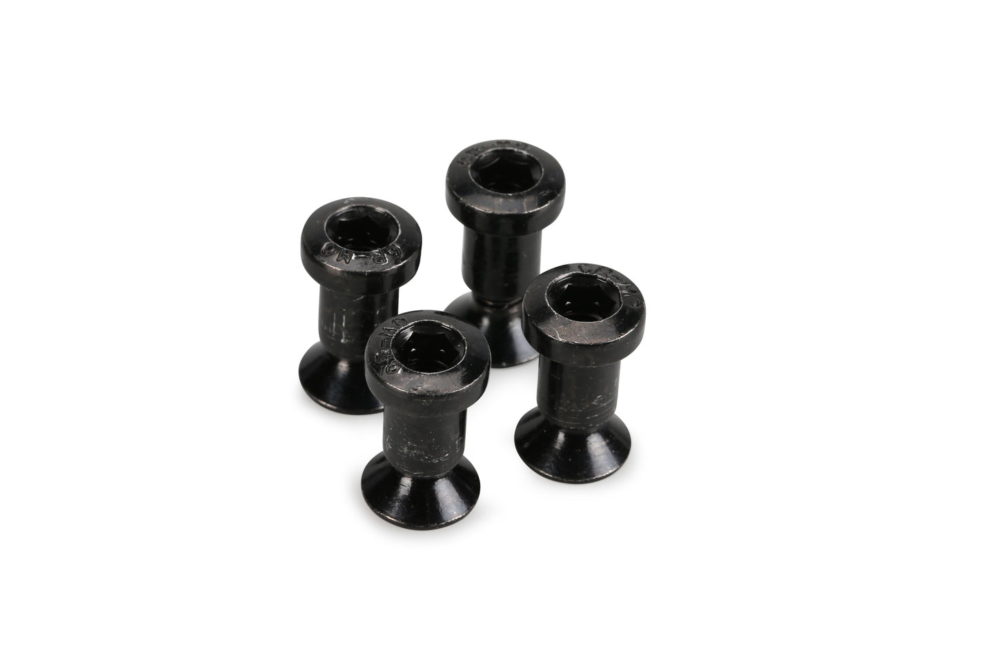 Four shoulder screws from Premiums Sprocket Guard set are clustered on a white background.