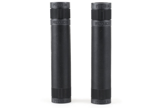 Two black flangeless cylindrical objects crafted from Krayton rubber, with ribbed surfaces and PREMIUM embossed on both ends. Standing upright side by side against a white background, their seamless design exudes modern elegance. Product Name: Premium Team Grip Flangeless. Brand: Premium.