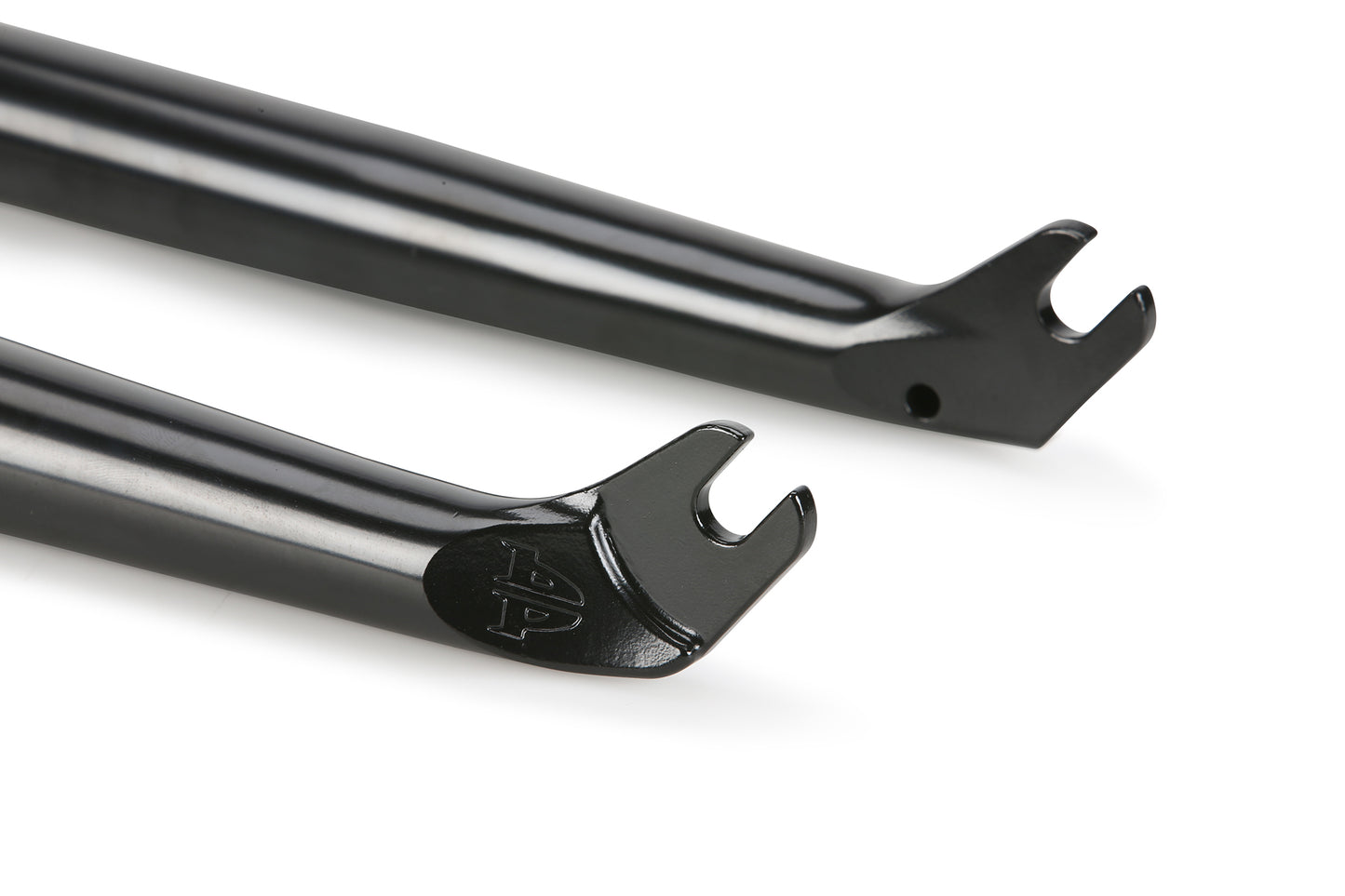 Close-up of a Premium Varanyak Forks black dropout showcasing its sleek, modern design. The glossy ends where the wheel axle attaches feature a hole for a screw by the cutout. With a short 20mm offset, its perfect for technical riding.