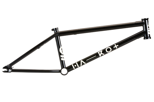 The SD V3 Frame by Haro Bikes is a sleek, minimalist black bicycle frame with white text and symbols on the down tube. Inspired by BMX frames and Dennis Enarsons style, it stands elegantly against a crisp white background.