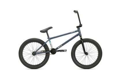 A blue Hoover BMX bike with a chromoly frame, black wheels and seat, shown from the side on a white background.
