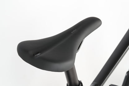 Close-up of a sleek, ergonomic black seat on a Haro MTB PD1 27.5 police bike against a plain white background.