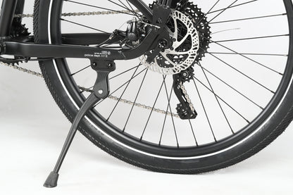 Close-up of the Haro MTB PD2 27.5 rear wheel and kickstand, showcasing the disc brake system, Microshift drivetrain, chain, and tire tread against a plain background that highlights the bikes components.