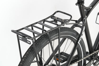 Close-up of a black rear rack mounted above the rear wheel of the Haro MTB PD4 27.5. The tire with visible tread supports the Police labeled frame, showcasing the racks structure and mounting details.