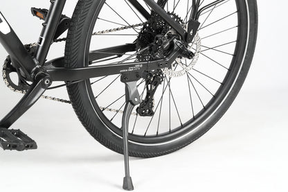 Close-up of the PD4 27.5 by Haro MTB, showing its black rear wheel and frame with boost spacing, a kickstand, and disc brakes against a plain white background.