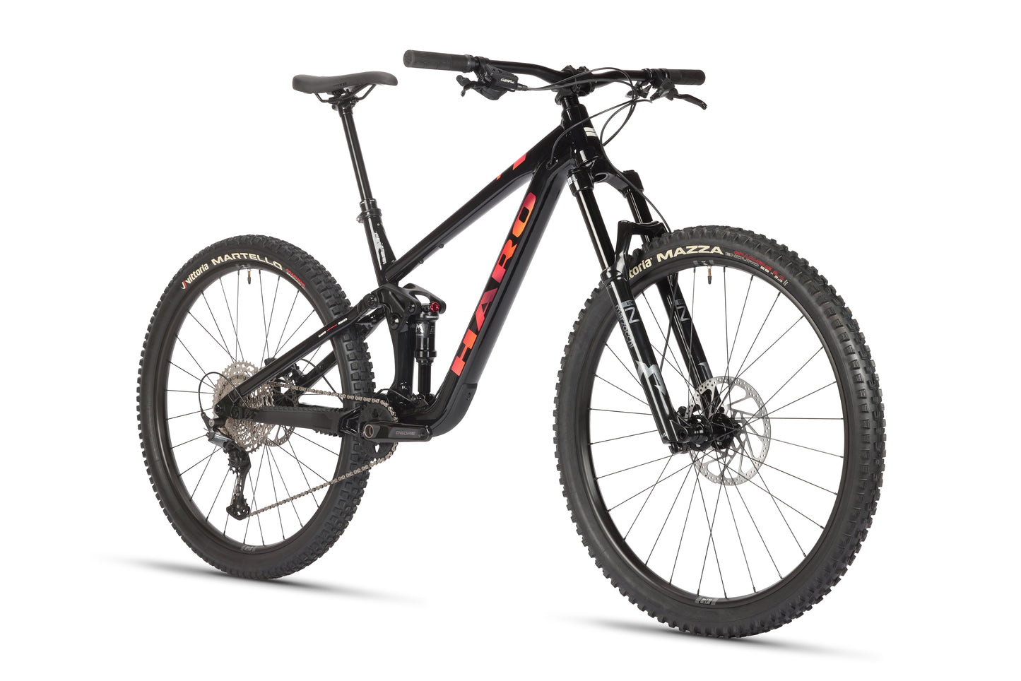 On display is the Daley Alloy 2, a Haro MTB all-mountain 29er bike. It features an aluminum frame with red lettering, wide tires, disc brakes, a front suspension fork, and a rear shock absorber for off-road cycling. Its rugged appeal and performance have impressed Daley.