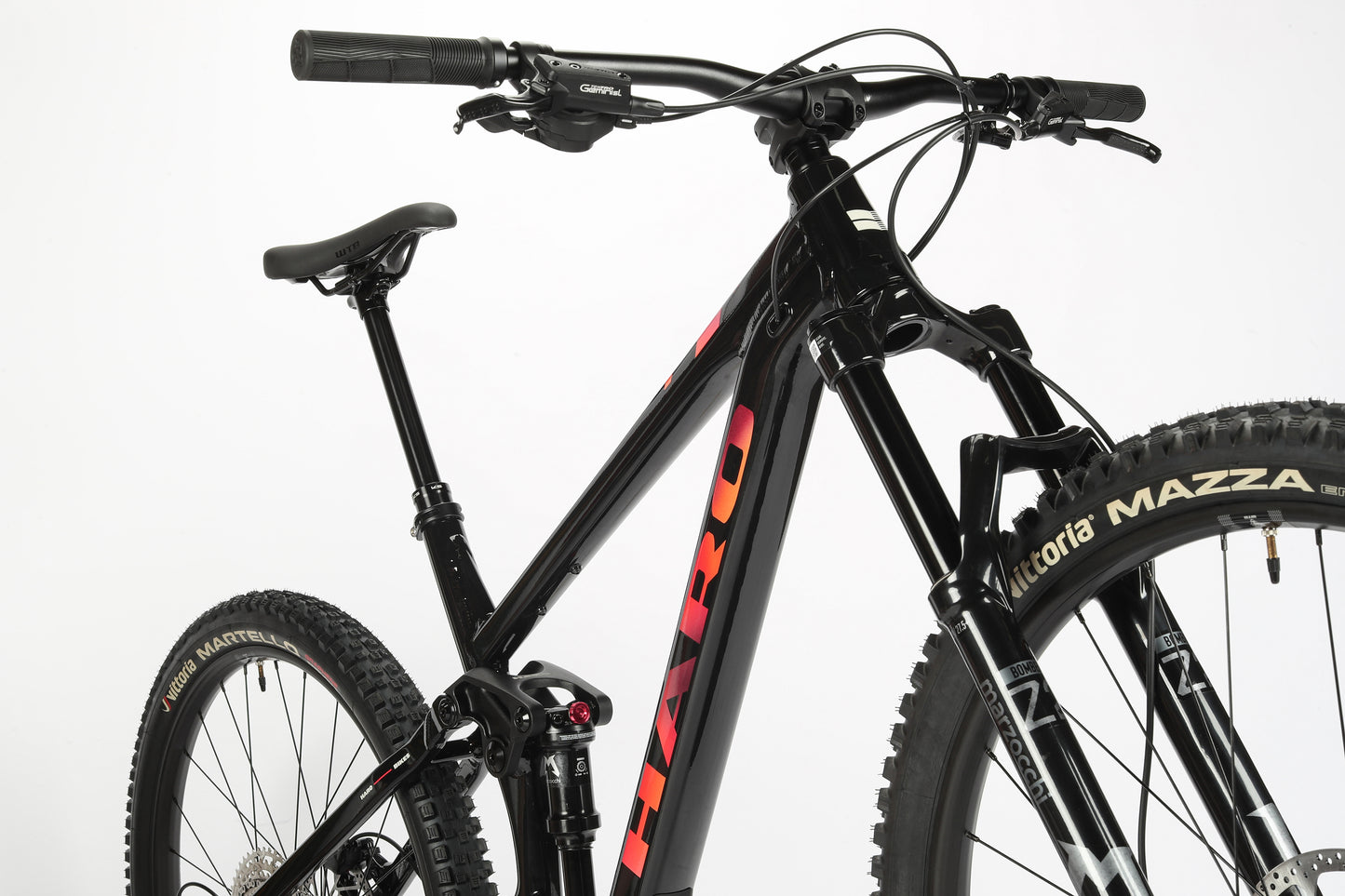 The Daley Alloy 2 by Haro MTB is a black mountain bike with an aluminum frame, off-road tires, front suspension fork, and ergonomic handlebars. It features the HARO logo and is shot against a white background.