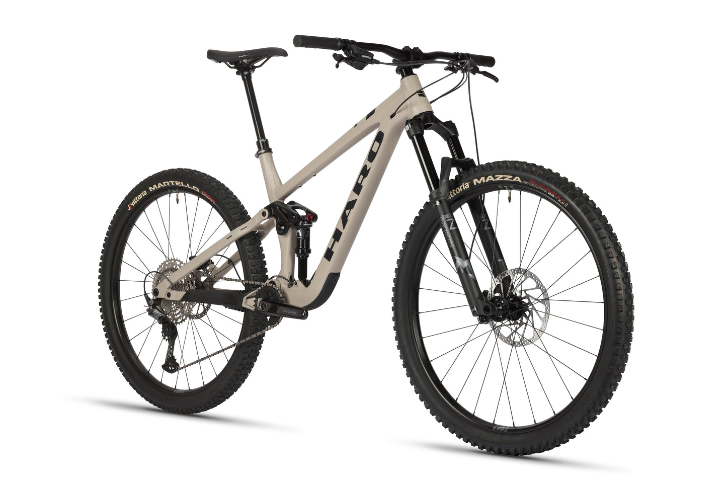 The Haro MTB Daley Alloy 2 is a beige all-mountain 29er bike featuring thick tires, front suspension, an aluminum frame with a bold Daley logo, disc brakes, and wide handlebars with a slight lean to the right on a white background.