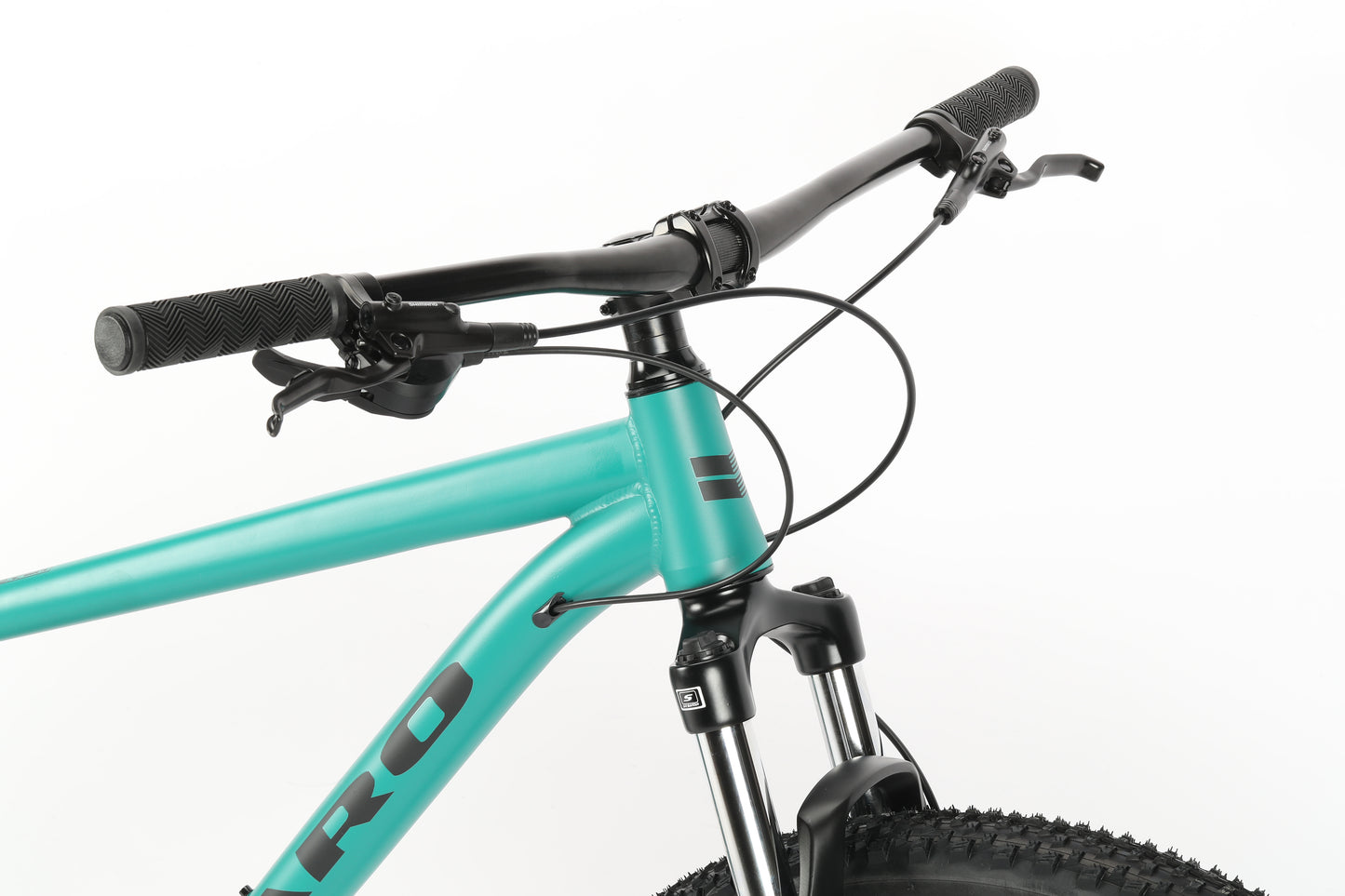 Close-up of a turquoise Haro MTB Flightline LTD 29s front, featuring handlebars, Shimano Cues brake cables, suspension fork, and front tire. The frameset has a sleek matte finish with black accents and Tektro hydraulic brakes for precision stopping.