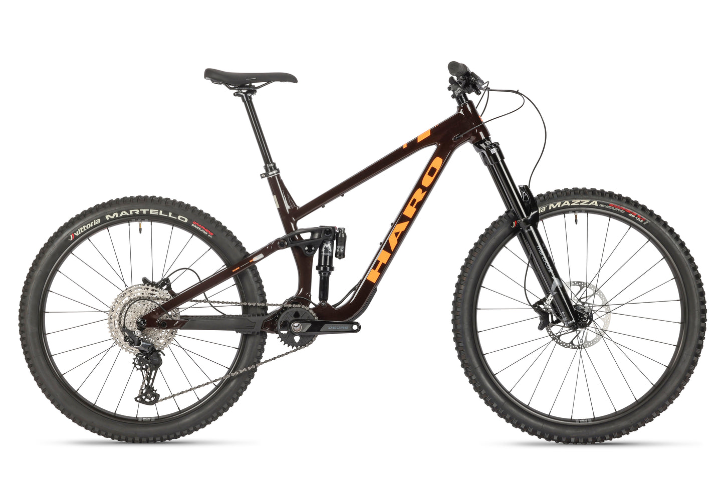 A black mountain bike with a performance alloy frame, full suspension, thick tires, and mullet wheel configuration features a prominent front fork. The Greer Alloy 2 by Haro MTB includes gears and disc brakes set against a crisp white background.