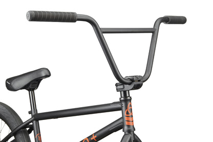 Close-up of the Burgess BMX handlebar, stem, and seat—orange accents highlight this versatile, high-performance bike.