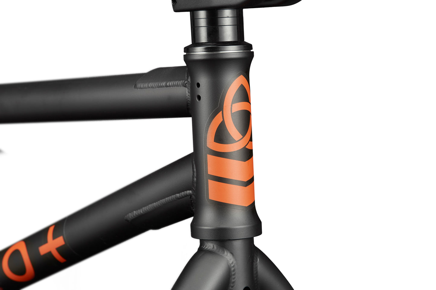 Close-up of the matte black Burgess frame with orange graphics—ideal for adventure and high-level riding.