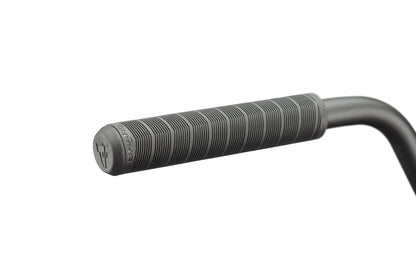 Close-up of a black Burgess handlebar grip with textured lines, ideal for high-level cycling.