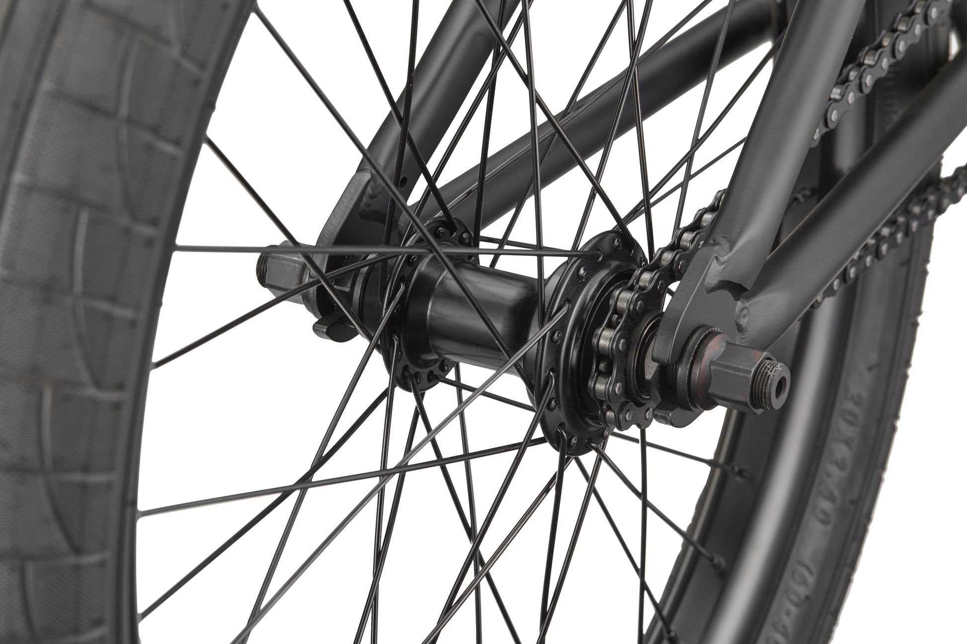 Close-up of the Burgess bike’s rear wheel, highlighting spokes, hub, axle, and chain—ideal for advanced riding.