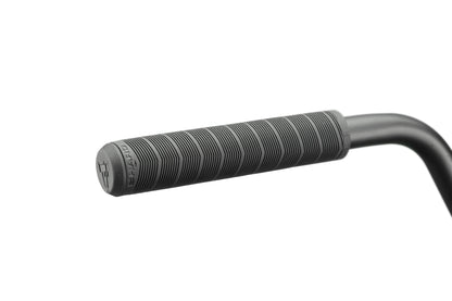 Close-up of a black Burgess handlebar grip with textured lines, ideal for intense riding, shown on a white background.